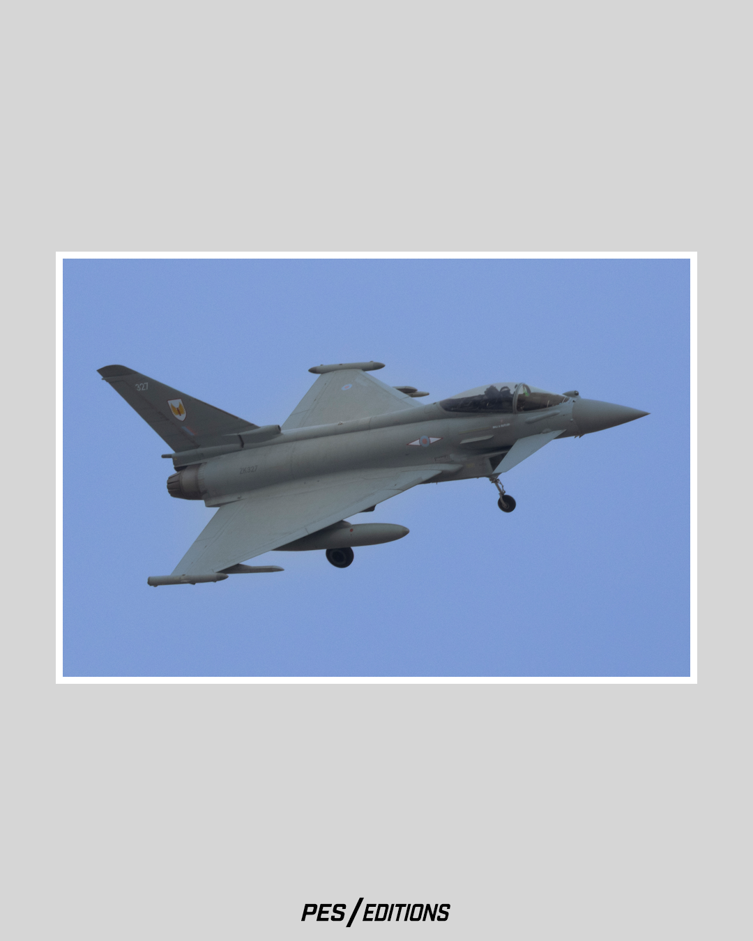 A Royal Air Force Eurofighter Typhoon (ZK327) on final approach. A sharp profile of the delta-wing fighter with landing gear deployed.