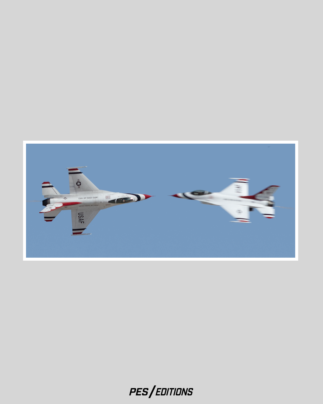 Two USAF Thunderbirds executing a high-speed opposing pass. The F-16s fly canopy-to-canopy in a precision knife-edge maneuver.