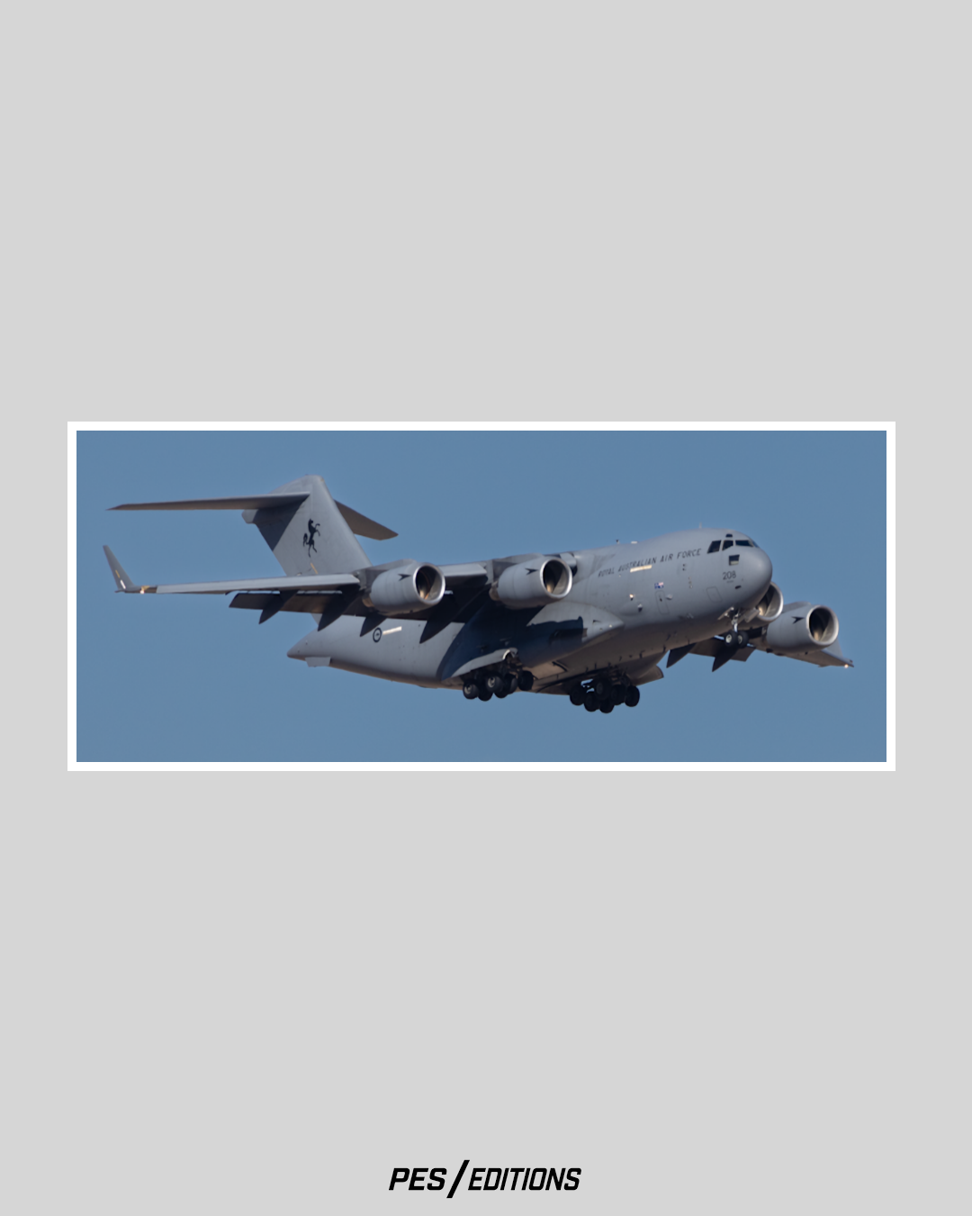 Royal Australian Air Force (RAAF) C-17A Globemaster III heavy transport aircraft, identified as number 208, flying with landing gear deployed against a clear blue sky.